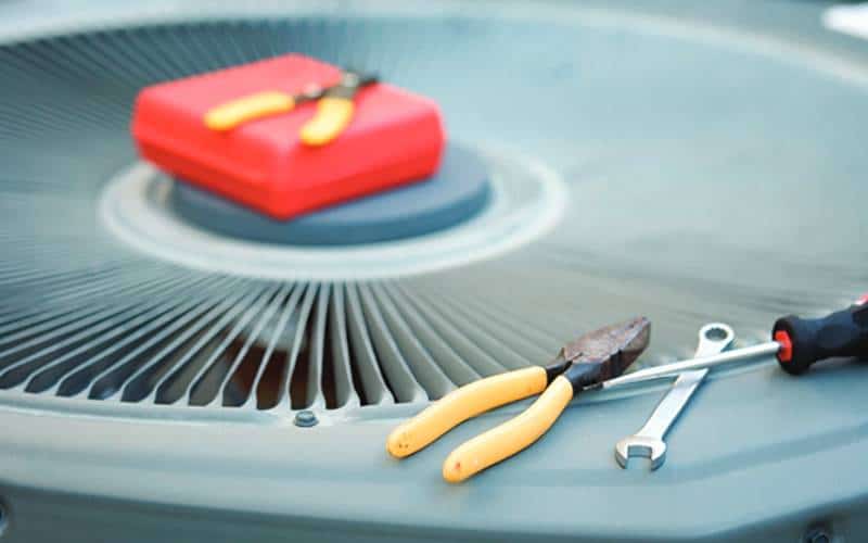 AC With Tools | Advanced Heating and Air Conditioning
