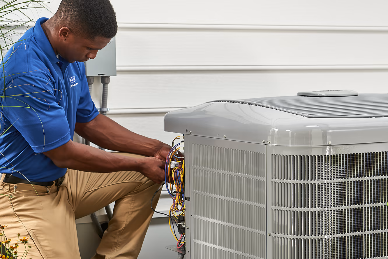 Carrier technician repairing unit | Advanced Heating and Air Conditioning